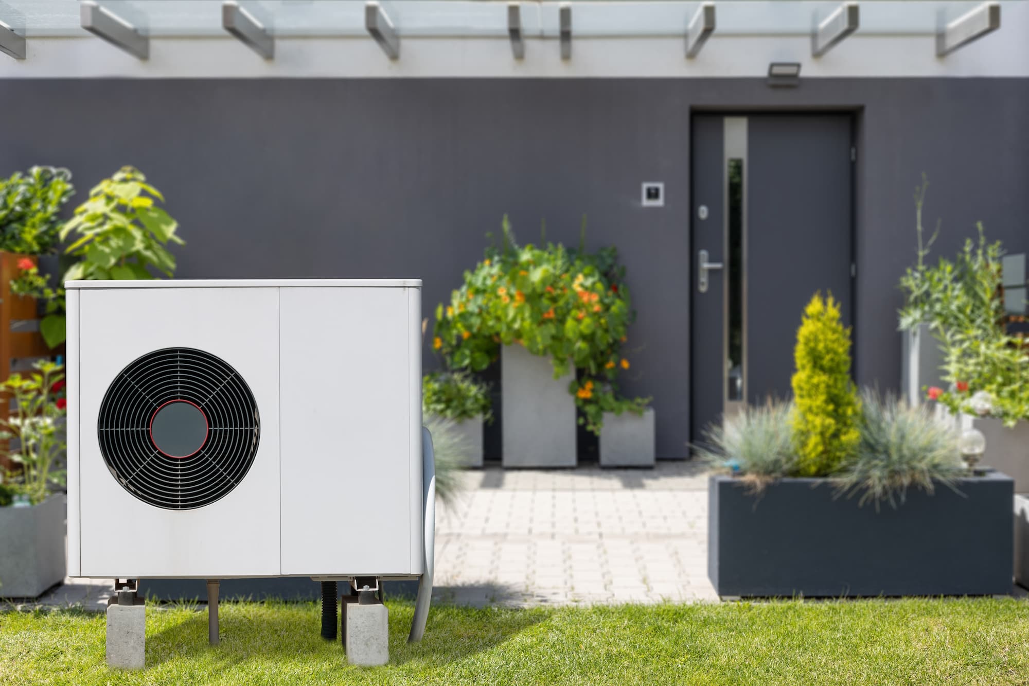 a photo of a backyard patio and heat pump